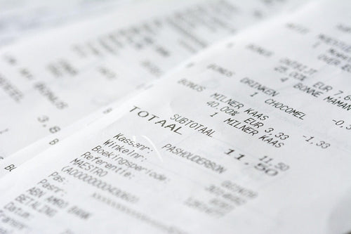 close-up of multiple printed receipts